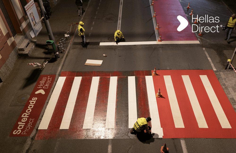 freshly painted crosswalk, safe roads project crew still working on it