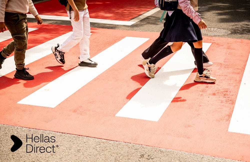 children feet crossing a crosswalk