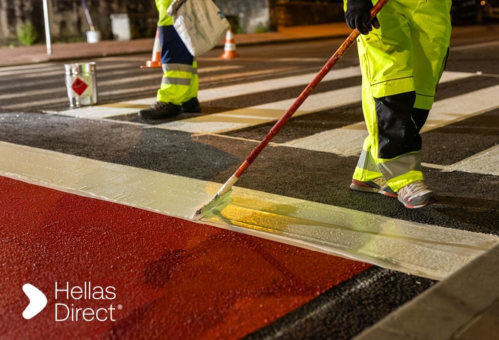 Safe Roads project's crew member fixing a crosswalk
